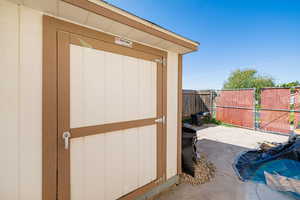 View of shed with a gate