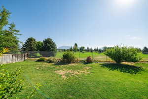 View of yard featuring a view of countryside and a mountain view