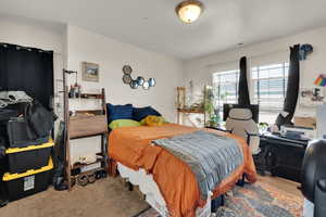 Bedroom featuring carpet flooring