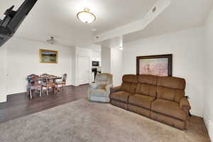 Living room with carpet flooring and baseboards
