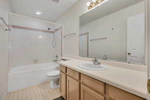 Bathroom featuring washtub / shower combination and vanity