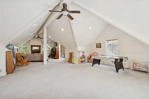 Rec room featuring beamed ceiling, light colored carpet, ceiling fan, high vaulted ceiling, and recessed lighting