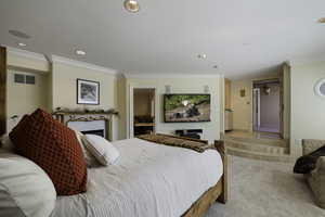Bedroom featuring crown molding, recessed lighting, and carpet floors