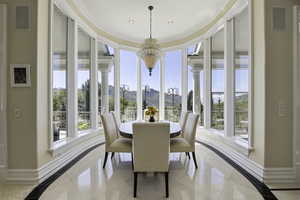 Dining room with a mountain view and ornamental molding