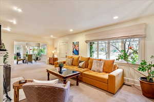 Living room featuring carpet and recessed lighting