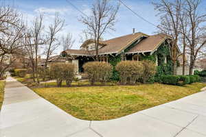 View of front of house with roof with shingles