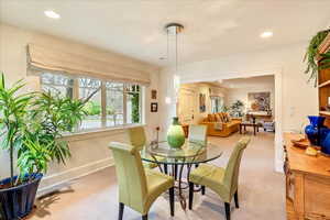 Dining space with carpet and recessed lighting