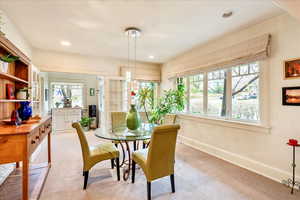 Carpeted dining space featuring baseboards and recessed lighting