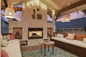 View of patio / terrace with an outdoor living space with a fireplace