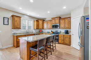 Kitchen with stainless steel appliances, granite counters, and recessed lighting