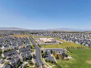 Aerial view of property's location featuring nearby suburban area and a mountain backdrop