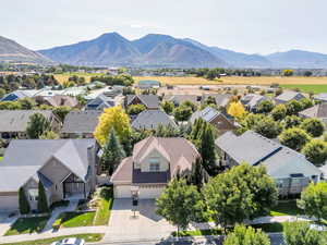 Aerial view of residential area featuring a mountainous background