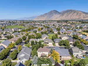 Aerial view of residential area featuring a mountain backdrop