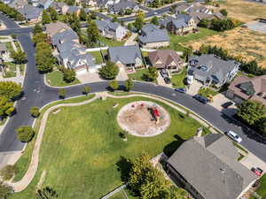 Aerial view of property and surrounding area with nearby suburban area
