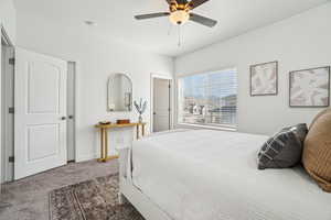 Bedroom with carpet and ceiling fan