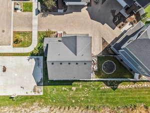 Aerial view with home, yard, and community playground in view
