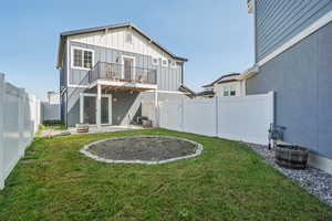 Back of house featuring a patio, board and batten siding, and a fenced backyard