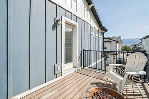 Balcony featuring a mountain view and a fire pit