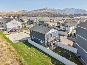 Aerial view of residential area featuring a mountain backdrop and showing the beautiful lack of neighbors to west.