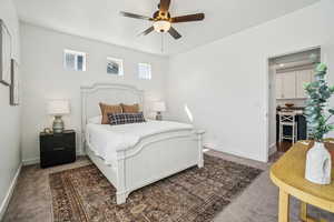 Bedroom with carpet flooring and a ceiling fan