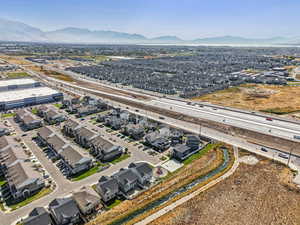 Aerial perspective of suburban area with a highway and mountains