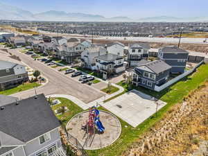 Aerial perspective of suburban area featuring a mountain backdrop