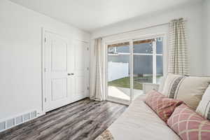 Living area featuring dark wood-type flooring