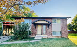 View of front of property featuring brick siding