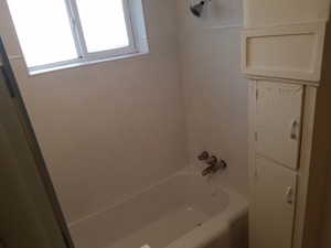 Full bath with shower / tub combination