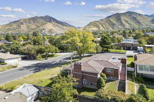 Aerial view of residential area featuring a mountain backdrop