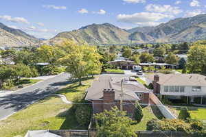 Aerial perspective of suburban area with a mountain backdrop