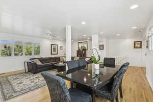 Dining area featuring light wood-style floors, recessed lighting, and ceiling fan