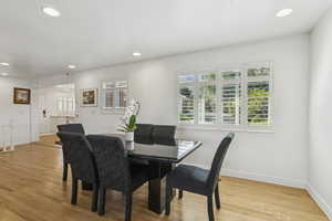 Dining space featuring recessed lighting and light wood-type flooring