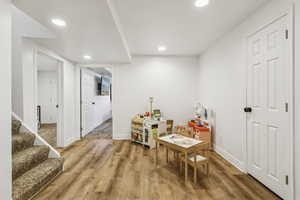Rec room featuring light wood-style floors and recessed lighting