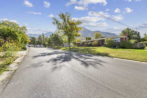 View of asphalt road featuring a mountain view