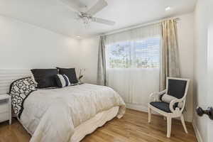 Bedroom with light wood-type flooring and ceiling fan
