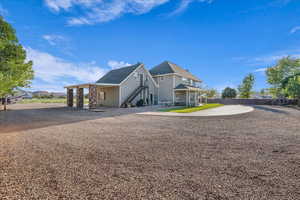 Rear view of house featuring stairs
