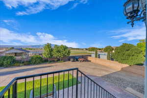 View of yard featuring a balcony and a mountain view