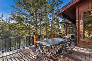 Wooden deck featuring outdoor dining space