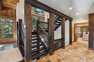 Staircase featuring recessed lighting and baseboards
