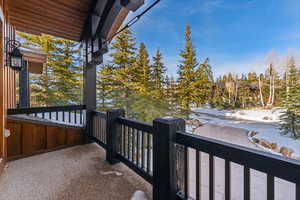 View of snow covered back of property