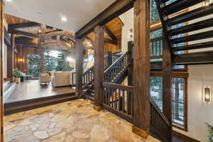 Stairway with stone finish floors and wooden walls
