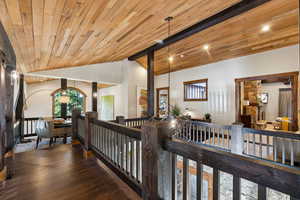 Corridor featuring an upstairs landing, wood finished floors, wooden ceiling, and recessed lighting