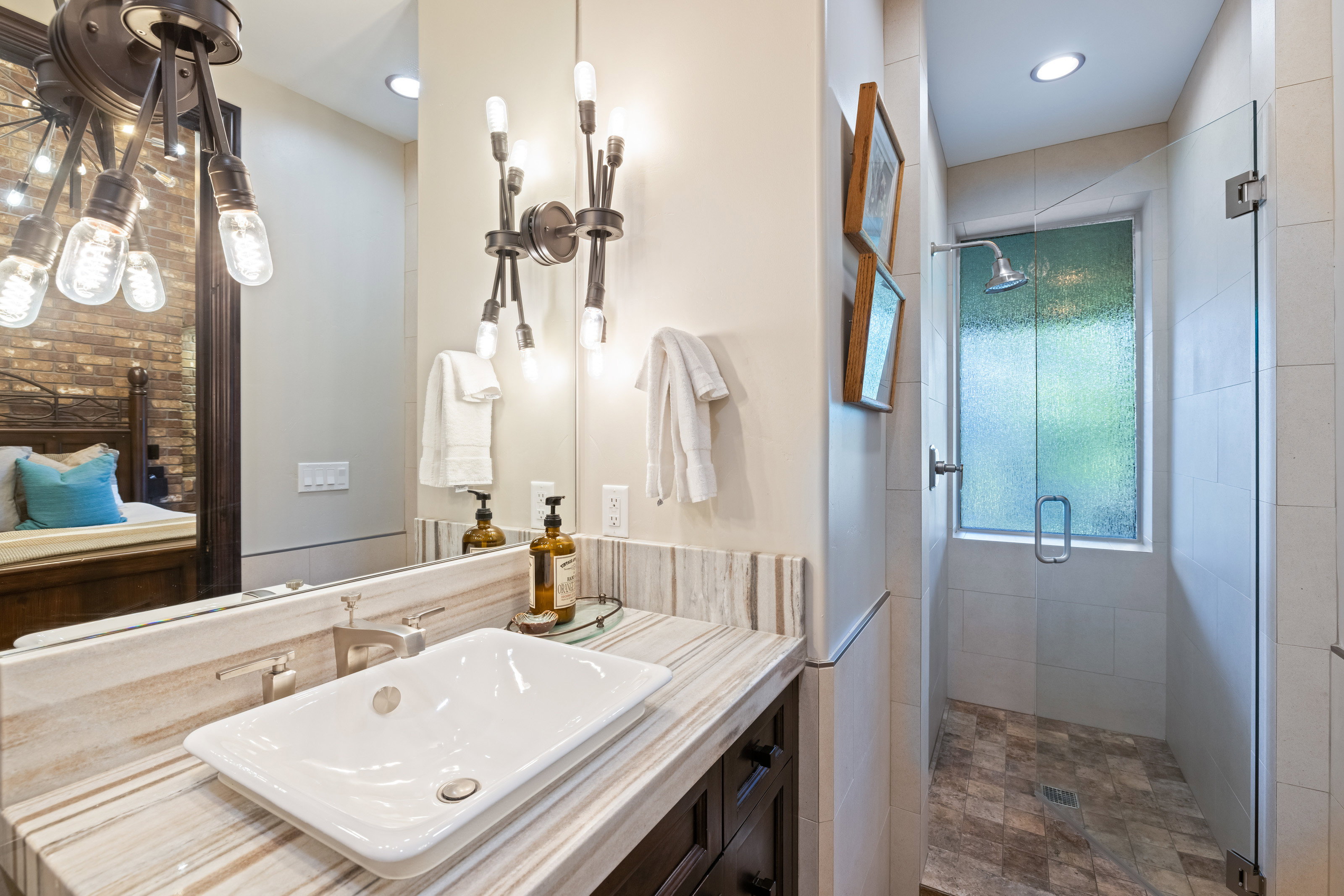 Bathroom with a stall shower and vanity