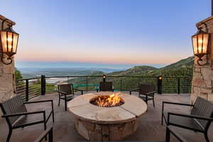 Patio terrace at dusk with a patio and a mountain view