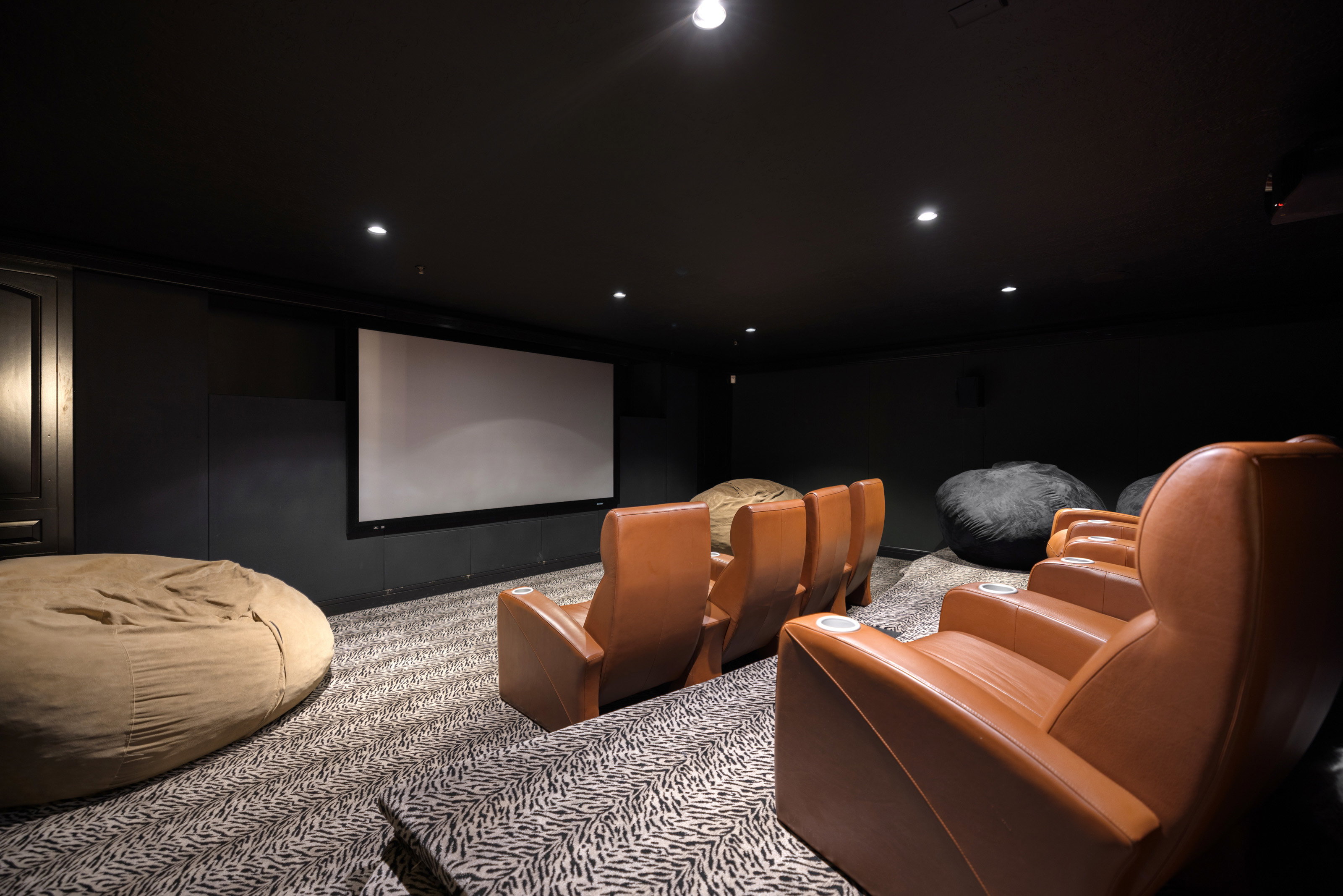 Carpeted home theater room featuring recessed lighting