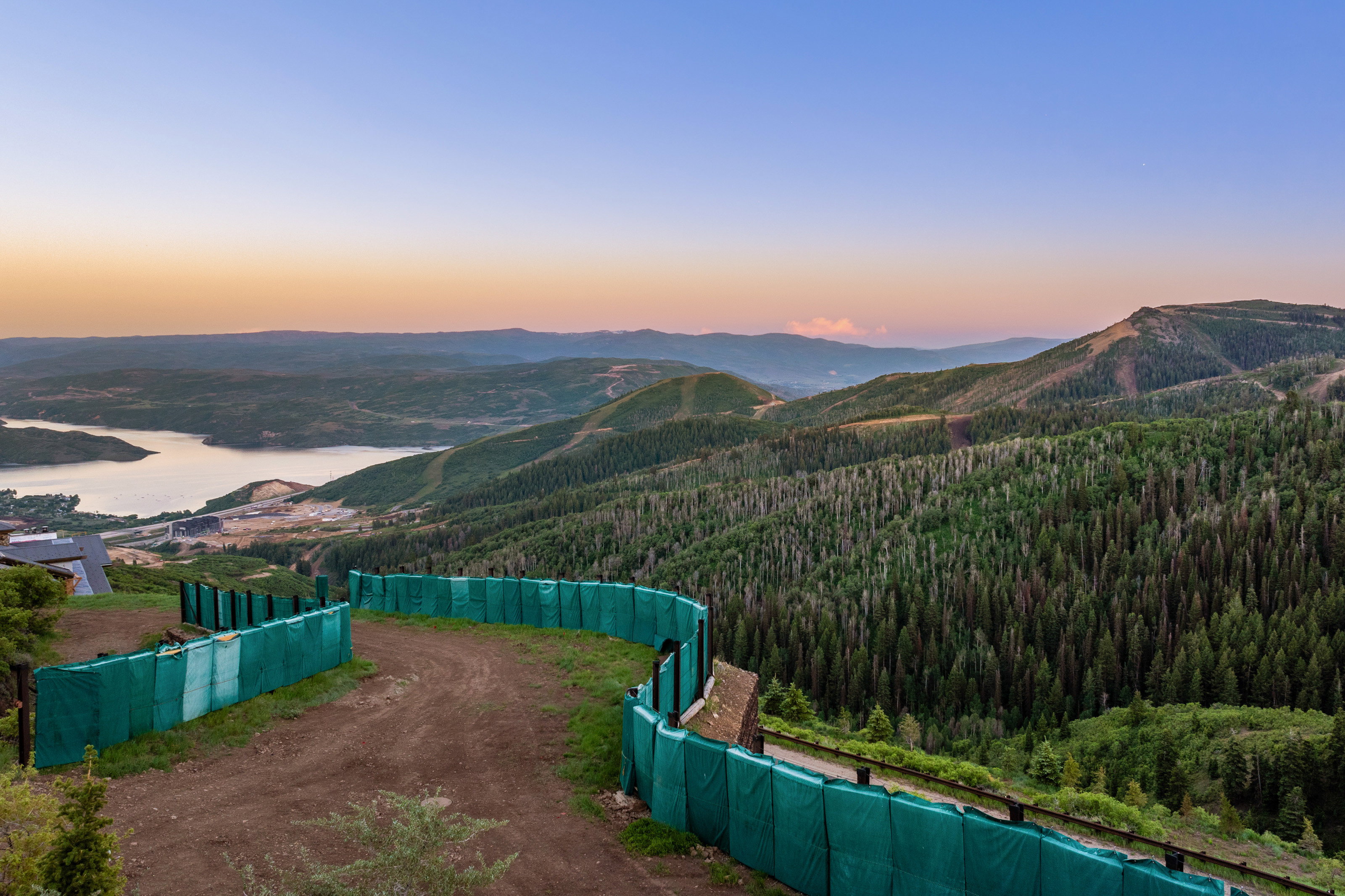 View of mountain backdrop with a heavily wooded area