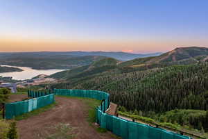 View of mountain backdrop with a heavily wooded area