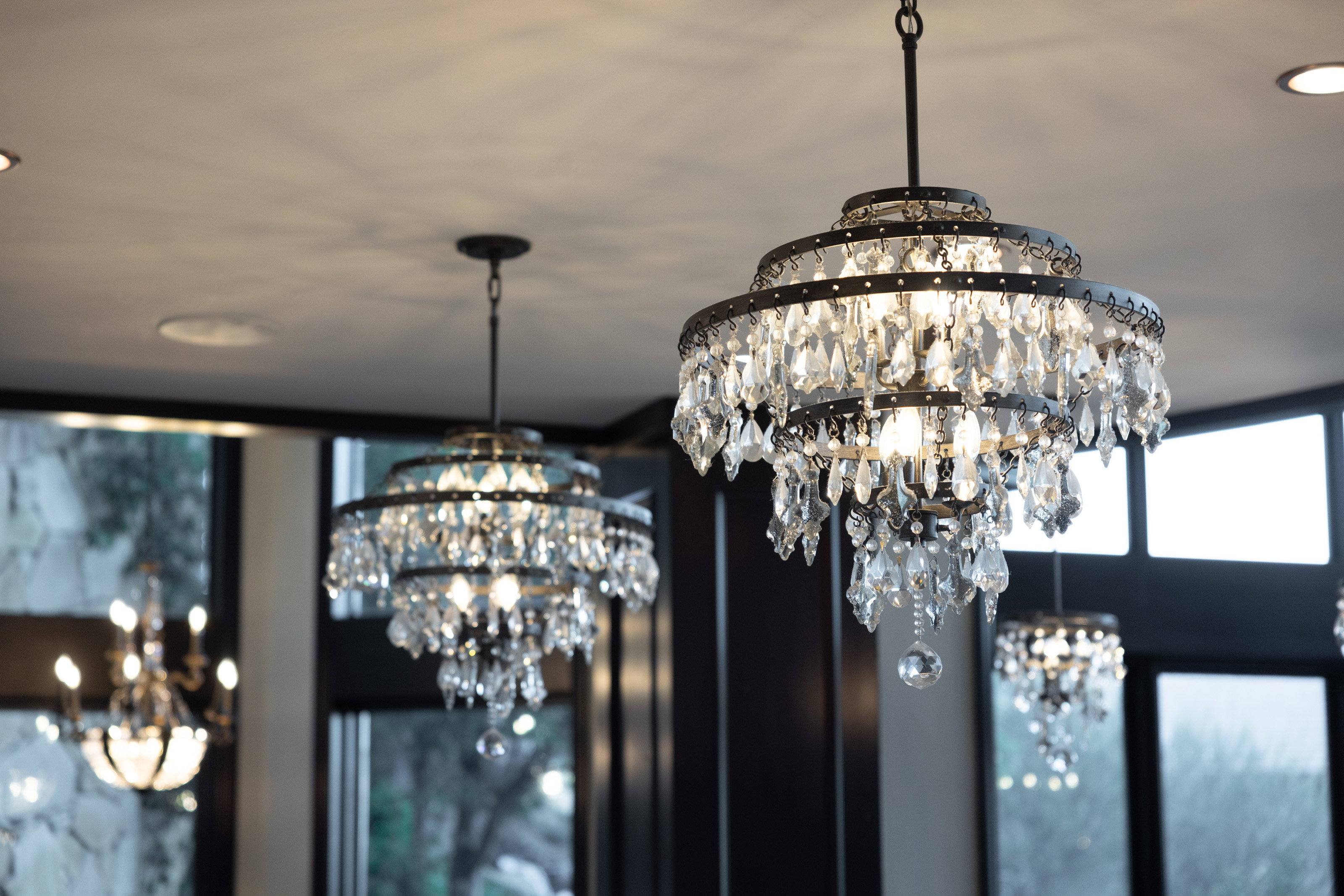 Detailed view of a chandelier and recessed lighting