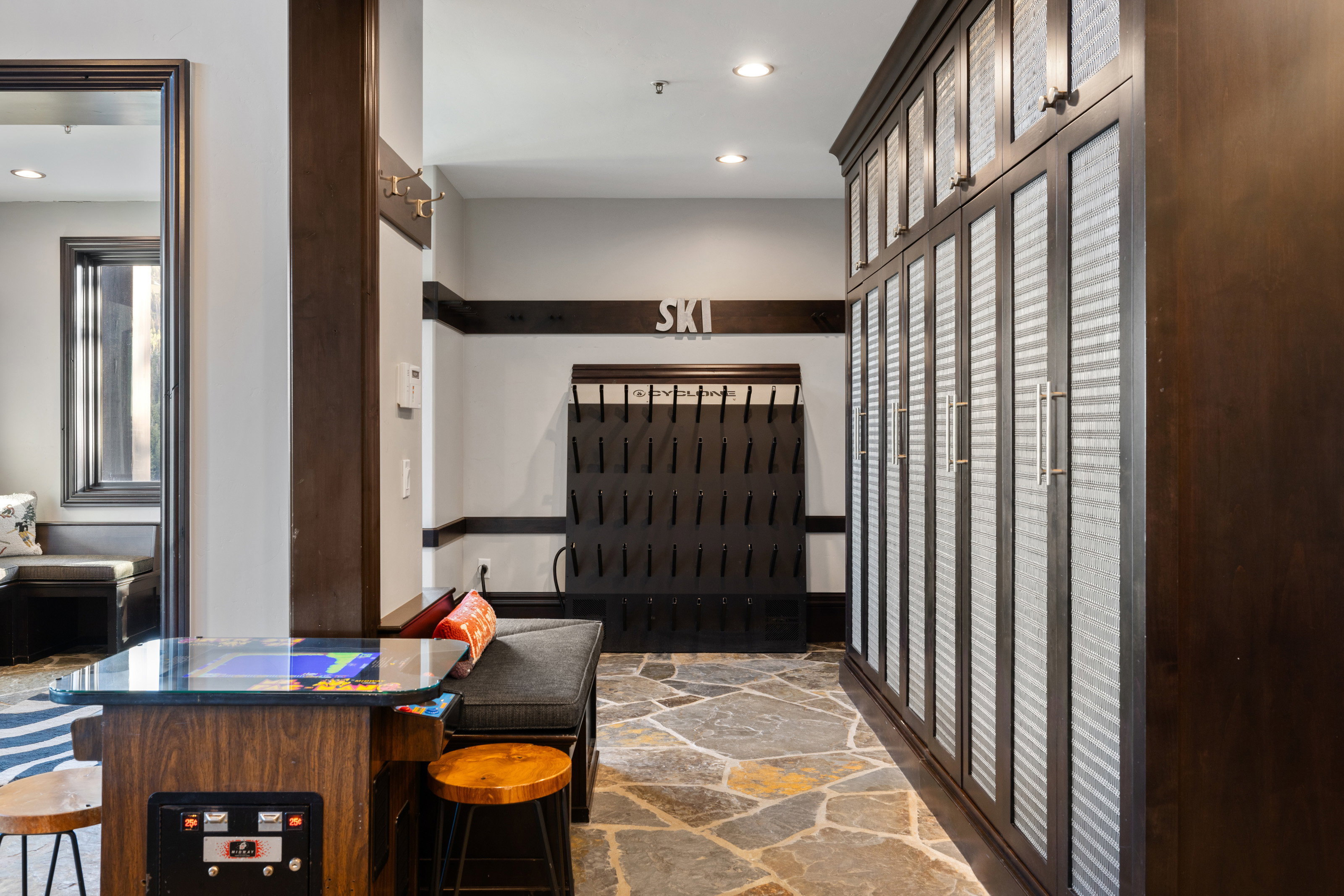 Interior space with stone flooring and recessed lighting